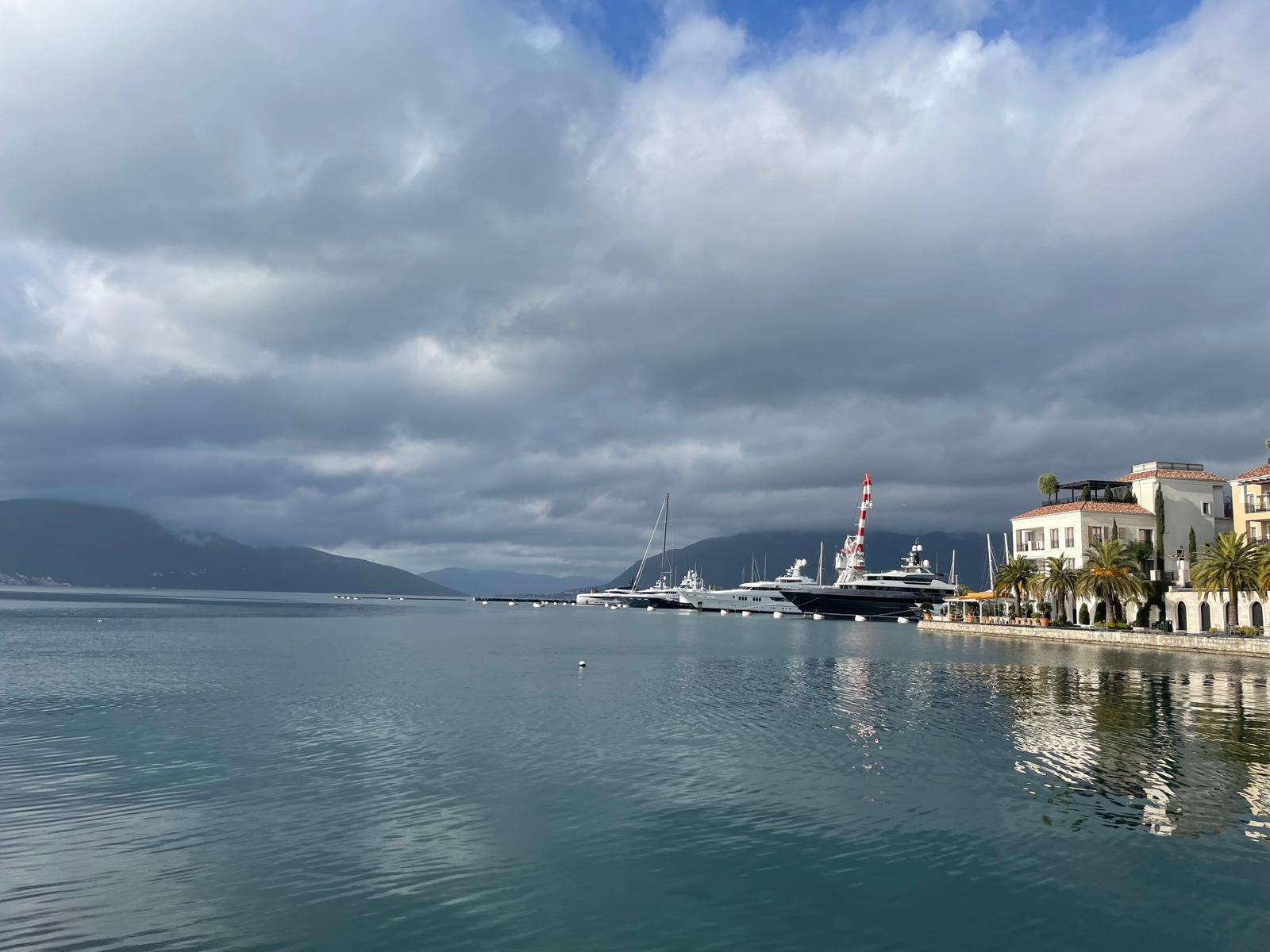 Cloudy harbor with yachts